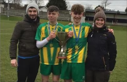  ??  ?? The two goalscorer­s, Kieran Murphy and captain Danny Bruce, with their teachers and coaches, Shane Murphy and Lisa Burke.