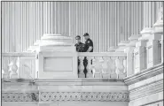  ?? AP/J. SCOTT APPLEWHITE ?? Capitol Police officers stand watch Thursday outside the House of Representa­tives in Washington, where the mood was somber a day after the baseball-practice attack.