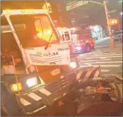  ??  ?? Cops said private trash hauler ran red light in Brooklyn and hit a city street sweeper.