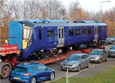  ?? GARETH JONES. ?? A driving vehicle from the 13th complete Class 385 built in Japan (385031) arrives at Newton Aycliffe on November 9. Twenty-one of the electric multiple units are expected to be available for ScotRail in February.