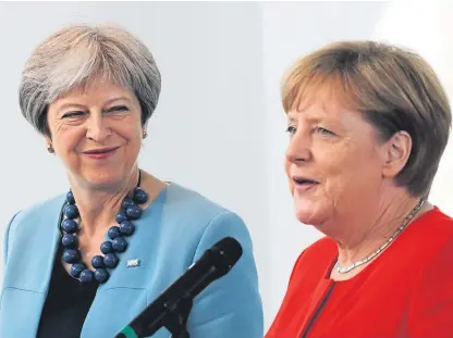  ?? Picture: AP. ?? Prime Minister Theresa May, left, and German Chancellor Angela Merkel prior to a meeting in the Chanceller­y in Berlin.