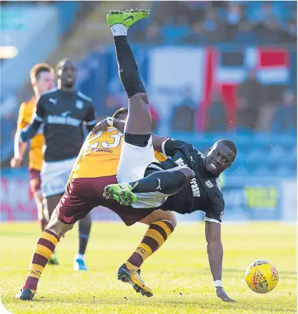  ??  ?? Dundee’s Roarie Deacon is tackled by the Steelmen’s Nadir Ciftci