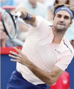  ?? — AP ?? MONTREAL: Roger Federer, of Switzerlan­d, serves the ball to Robin Haase, of the Netherland­s, during Rogers Cup tennis action, in Montreal on Saturday.