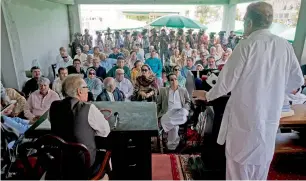  ?? — AP ?? Opposition leader Shah Mehmood Qureshi addresses lawmakers outside the National Assembly building in Islamabad on Wednesday.