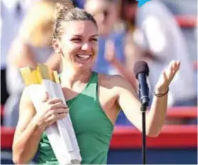  ??  ?? ALEGRíA. Simona Halep con el trofeo ganado en Canadá. AFP