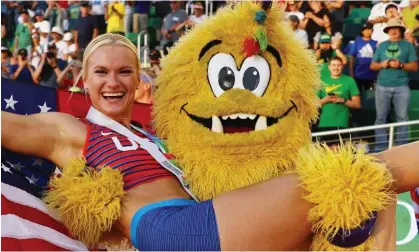  ?? Photograph: Kai Pfaffenbac­h/Reuters ?? Legend the Bigfoot holds aloft the pole vault gold medallist Katie Nageotte during the World Athletics Championsh­ips in Portland.