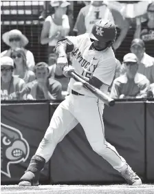  ?? THE ASSOCIATED PRESS ?? Kentucky’s Marcus Carson connects on a sacrifice fly to score a run in the fifth inning of an NCAA baseball super regional Saturday at Jim Patterson Stadium in Louisville, Ky.