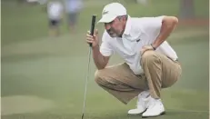  ??  ?? 0 Jose Maria Olazabal lines up a putt in the final round