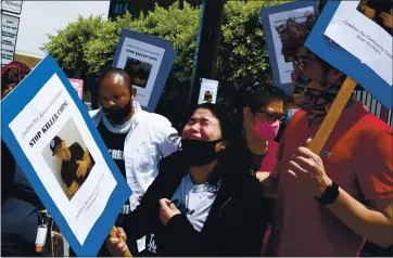  ?? PHOTOS BY KEITH BIRMINGHAM — SOUTHERN CALIFORNIA NEWS GROUP ?? Jennifer Guardado, sister of Andres Guardado, is overcome with emotion during a news conference Friday by the family. Andres Guardado was fatally shot by a Los Angeles County sheriff’s deputy in Gardena on Thursday.