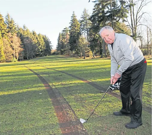  ?? Picture: Gareth Jennings. ?? Letham Grange member Terry Milne from Forfar tries to avoid the tyre tracks on the 17th hole.