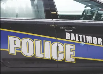  ?? AP PHOTO/JULIO CORTEZ ?? A Baltimore police cruiser is seen outside of a building as officers check on a call in 2021, in Baltimore.