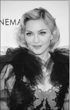  ?? Theo Wargo, Getty Images ?? Madonna’s single Give Me All Your Luvin’ will be released a few days
before the Super Bowl.