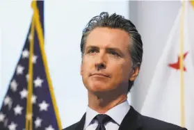  ?? Rich Pedroncell­i / Associated Press ?? Gov. Gavin Newsom says reopening California after the shutdown will not involve a big “flip of a switch” but instead will be more like turning up a dimmer.