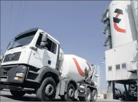  ?? PHOTO: BLOOMBERG ?? A concrete transporte­r at the Holcim cement works in Hamburg, Germany. Even though Holcim and Lafarge have agreed on Eric Olsen as chief executive, the merger still faces opposition.