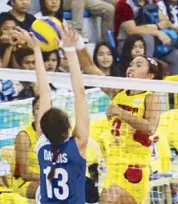  ??  ?? RC Cola-Army’s Rachel Anne Daquis blocks a spike by F2 Logistics’ Abby Marano in the Superliga Invitation­al at the Malolos Sports and Convention Center.