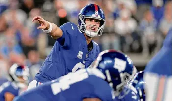  ?? Adam Hunger/associated Press ?? Giants quarterbac­k Daniel Jones was back at practice on Wednesday for the first time since injuring his neck against at Miami.