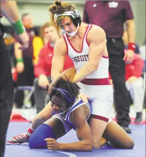  ?? Christian Abraham / Hearst Connecticu­t Media ?? Fairfield Prep’s George Tsiranides, top, tries to turn over Brookfield’s Zahir McLean- Feliz during the CIAC State Open in New Haven on Saturday.