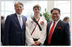  ??  ?? John Rockefelle­r (center) with Kim Sung Tae of Kukkiwon, South Korea, and President Sang Yong Hong of Gangnam-Gu (Gangnam District), Seoul, South Korea, at the masters induction ceremony