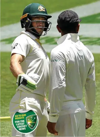  ?? Photo: Ryan Pierse/Getty Images ?? IN YOUR FACE: Tim Paine and Virat Kohli almost come together on day four at Optus Stadium.