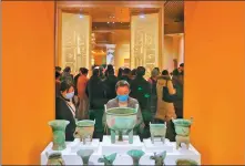  ?? JIANG DONG / CHINA DAILY ?? Visitors tour an exhibition hall of bronzeware at the Yinxu Museum in Anyang, Henan province, last month, as the museum officially opens.