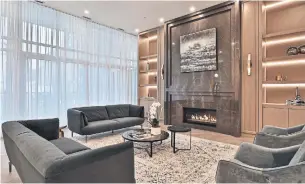  ?? JORDAN PRUSSKY PHOTOS THE PRINT MARKET ?? The living room has hardwood flooring, a linear gas fireplace with marble surround and built-in shelves, floor-to-ceiling windows and a walkout to a terrace.
