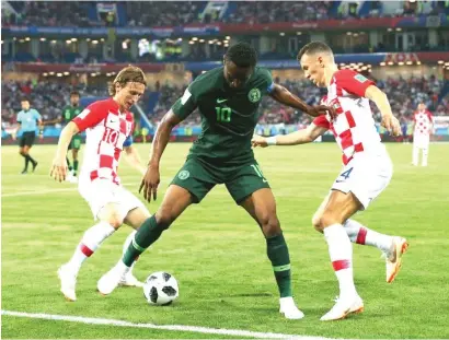  ??  ?? John Obi Mikel of Nigeria is approached by Luka Modric and Ivan Perisic of Croatia during their FIFA 2018 World Cup Group D match at the Kaliningra­d Stadium