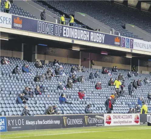  ??  ?? 0 Socially distanced fans at Murrayfiel­d when the stadium hosted Edinburgh v Glasgow Warriors as a test event in August