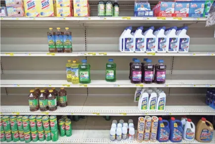 ?? MAX GERSH / THE COMMERCIAL APPEAL ?? Low stock on certain cleaning supplies leaves holes in product on the shelves Monday, Sept. 14, at Cash Saver in Memphis.