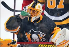  ?? GENE J. PUSKAR - THE ASSOCIATED PRESS ?? Pittsburgh Penguins goaltender Casey DeSmith drinks during the third period of an NHL hockey game against the Columbus Blue Jackets in Pittsburgh, Friday, April 29, 2022.