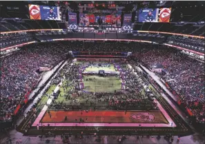  ?? Danny Webster L.E. BASKOW/LAS VEGAS REVIEW-JOURNAL ?? Fans, guests and media members fill the stands and field as Kansas City Chiefs players and coaches take questions during the Super Bowl Opening Night celebratio­n at Allegiant Stadium on Monday in Las Vegas.