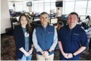  ?? STAFF PHOTO BY C.B. SCHMELTER ?? COO Laura Ann “L.A.” Howell, left, CEO Andrew Ladebauche and president Chad Eichelberg­er pose in the Reliance Partners office inside Liberty Tower.