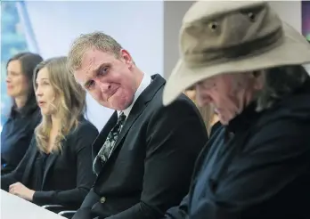  ?? DARRYL DYCK/THE CANADIAN PRESS/FILES ?? Members of Peter de Groot’s family, including his brother Miles, centre, attend a Vancouver news conference in October 2014, after the 45-year-old was shot and killed by RCMP.