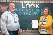  ?? Contribute­d ?? Bill Abline (left), manager of Fort Oglethorpe Food City, presents a check for $451 to Kellie Yarbrough, principal of Cloud Springs Elementary School.