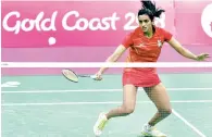  ?? PTI ?? PV Sindhu knocks out defending champion Michelle Li 21-18 21-8 in just 26 minutes. —