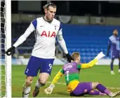  ?? — AP ?? Tottenham’s Gareth Bale celebrates after scoring against Wycombe in their FA Cup fourth round match in High Wycombe, England, on Monday.