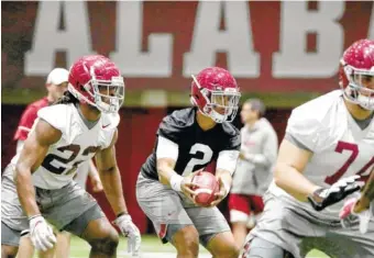  ?? KENT GIDLEY/ALABAMA PHOTO ?? Alabama junior quarterbac­k Jalen Hurts takes a snap during Tuesday’s start to spring practice in Tuscaloosa.