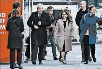  ?? NIKLAS HALLE'N/GETTY-AFP ?? British Prime Minister Boris Johnson, left, and Home Secretary Priti Patel arrive Saturday at the scene of a stabbing on London Bridge.