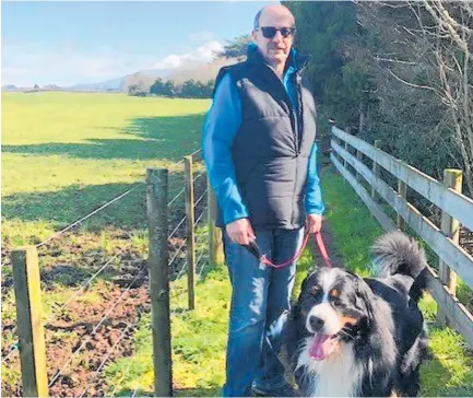  ?? Photo / Supplied ?? Alan, pictured with his dog Loki, says he is always happy to stop and listen to people’s views on council matters when he is out and about in the community.