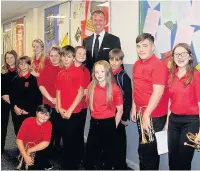  ??  ?? Philip Harper, musical director of Cory with students