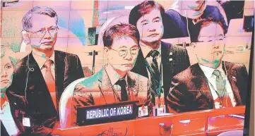  ?? — AFP photo ?? The delegation from North Korea, seen on an overhead video screen, watches as Moon addresses the United Nations General Assembly in New York City.
