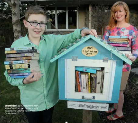  ??  ?? Bookended Jack Castell and his mom, Juliann Castell, worked together to build this Little Free Library in front of their Ottawa home