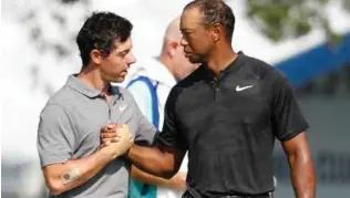  ?? FOTO: AP/NTB SCANPIX ?? Rory McIlroy (t.v.) og Tiger Woods møtes i Ryder Cup.