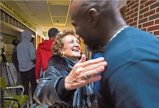  ?? — Photos: TNS ?? Spector hugging Willingham who runs Makings of a Man mentorship programme at the Samuel F.B. Morse Recreation Center. Spector has been meeting and mentoring the two juveniles who carjacked her in 2016, through the non-profit UEmpower of Maryland, which...