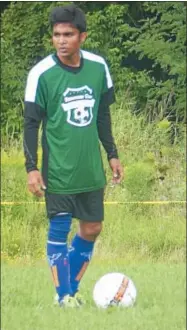  ??  ?? Khin Maung Tint competes in the Redeemer Cup in Proctor Park, a soccer tournament meant to foster ties among different communitie­s in Utica.