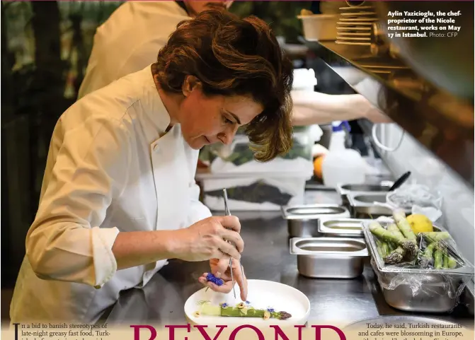  ?? Photo: CFP ?? Aylin Yazicioglu, the chefpropri­etor of the Nicole restaurant, works on May 17 in Istanbul.