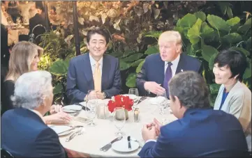  ??  ?? Donald Trump, Japanese Prime Minister Shinzo Abe (second left), his wife Akie Abe (right), US First Lady Melania Trump (left) and Robert Kraft,owner of the New England Patriots, sit down for dinner at Trump’s Mar-a-Lago resort. — AFP photo