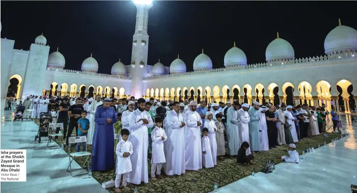  ?? Victor Besa / The National ?? Isha prayers at the Sheikh Zayed Grand Mosque in Abu Dhabi