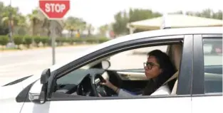  ?? - Reuters file ?? MOVE WELCOMED: Trainee Maria Al Faraj stops the car at a stop sign during a driving lesson with her instructor at Saudi Aramco Driving Centre in Dhahran, Saudi Arabia, June 6, 2018.