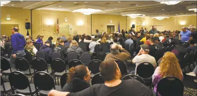  ?? Alexander Soule / Hearst Connecticu­t Media ?? Above and below, members of the United Food & Commercial Workers Local 371 await for a Stop & Shop contract ratificati­on meeting Thursday in a ballroom set up to accommodat­e 550 people at the Wyndham Southbury Hotel