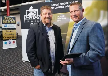  ?? JESSICA GRIFFIN/PHILADELPH­IA INQUIRER ?? Michael Risich, left, Founder &amp; CEO, and Frank Dragoni, right, Director of Sales and Corporate Partnershi­ps, at Bolt On Technology, in Southampto­n, Pa., on Oct. 11.